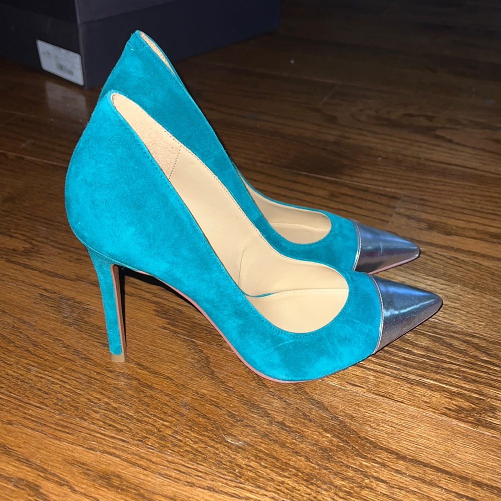 MK heels with silver tip.